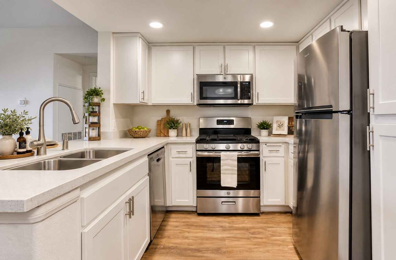Ritiro Apartments Las Vegas digitally altered white cabinet kitchen with stainless steel appliances