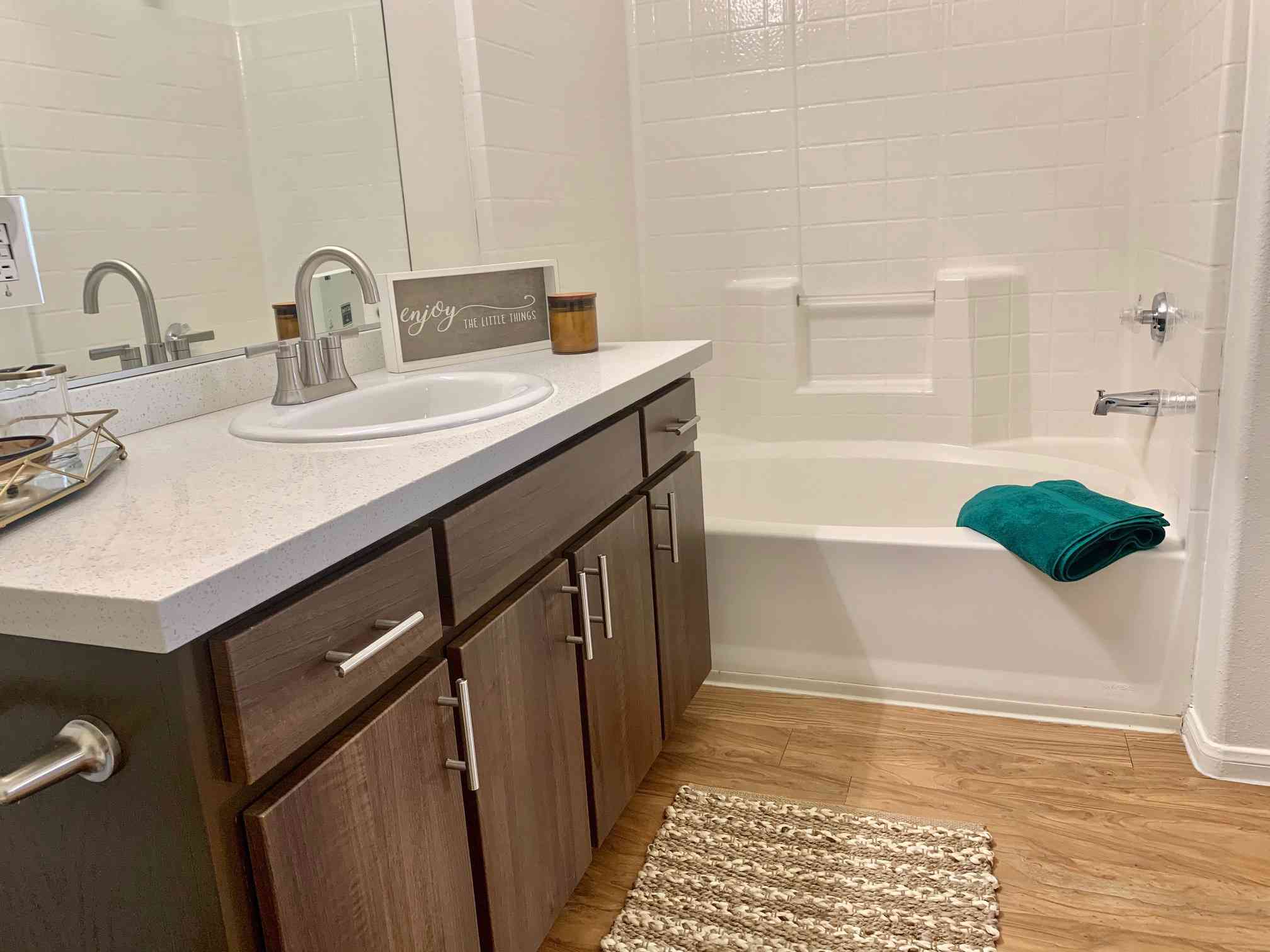 brown cabinet quartz countertop bathroom view