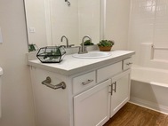 Ritiro Apartments bathroom quartz countertop sink